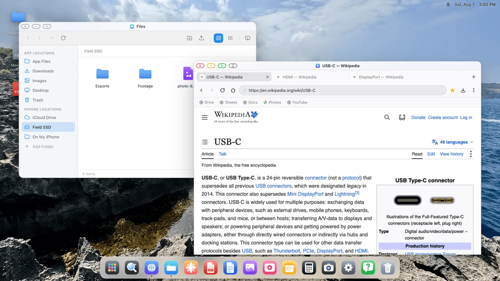 The XeOS desktop in light appearance filling an external monitor.