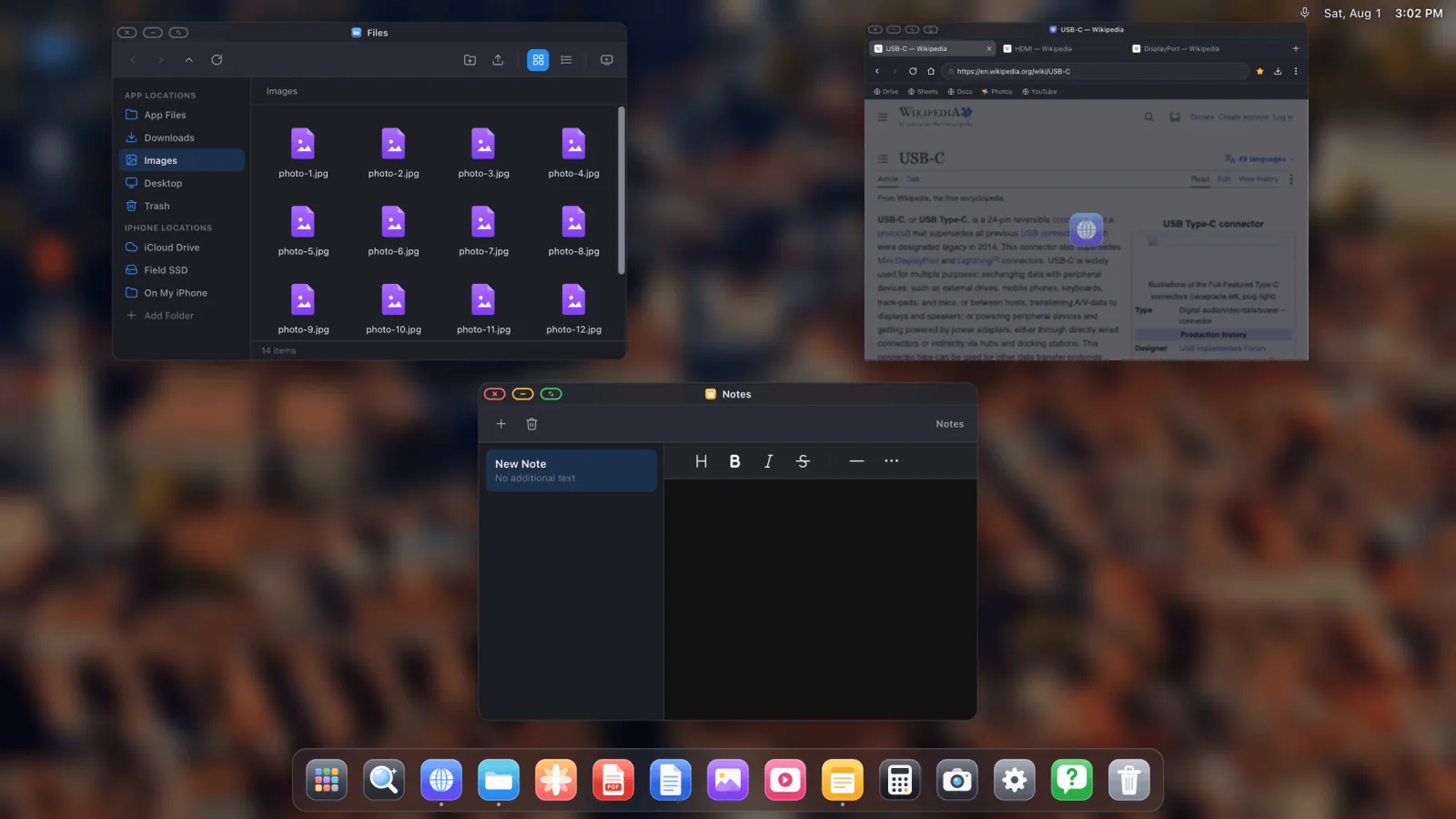 The window overview on an external display, showing a file manager, a browser and a notes window laid out together.