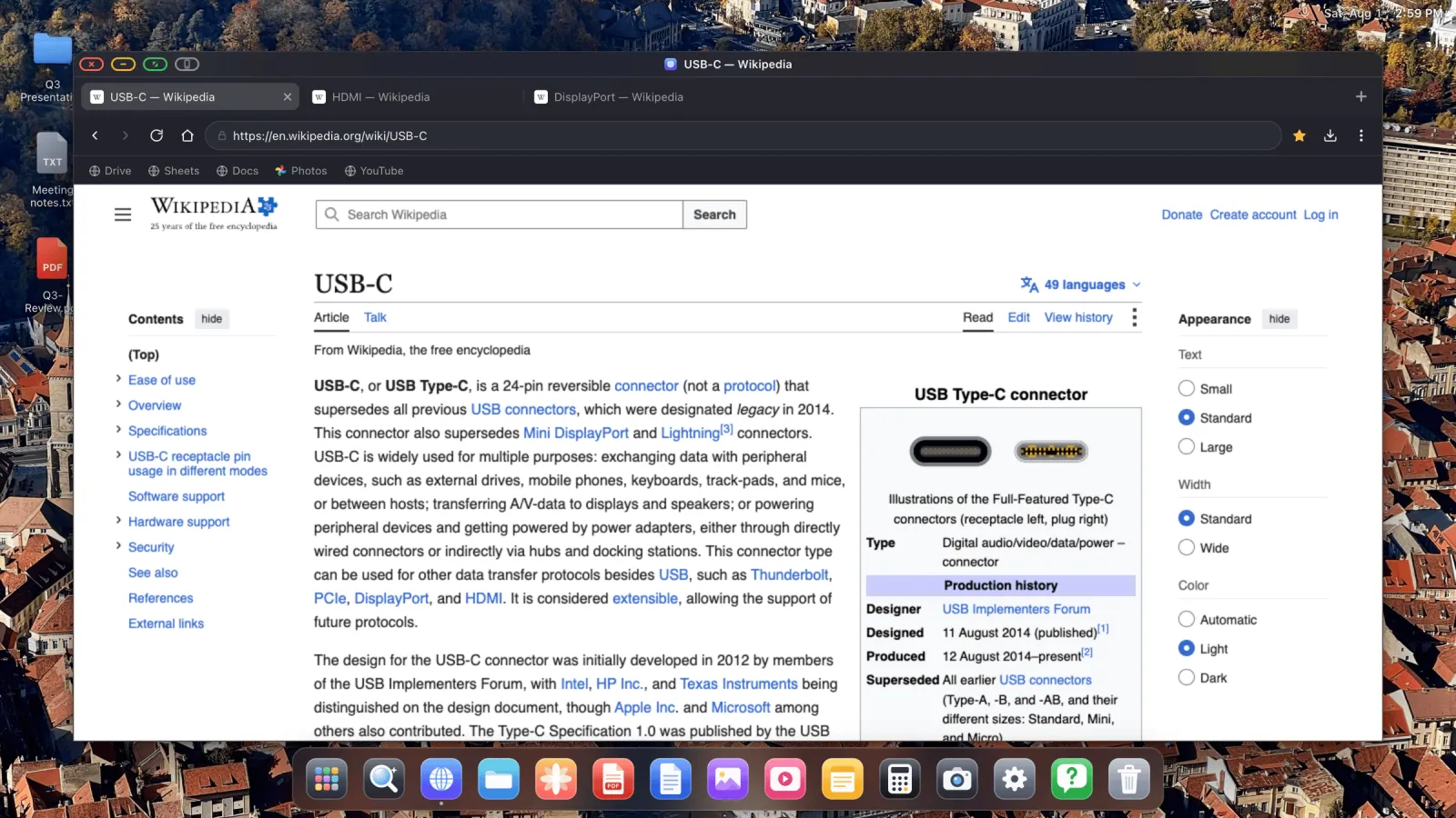 A desktop browser window with tabs, an address bar and a bookmarks bar showing a full Wikipedia page on an external monitor.