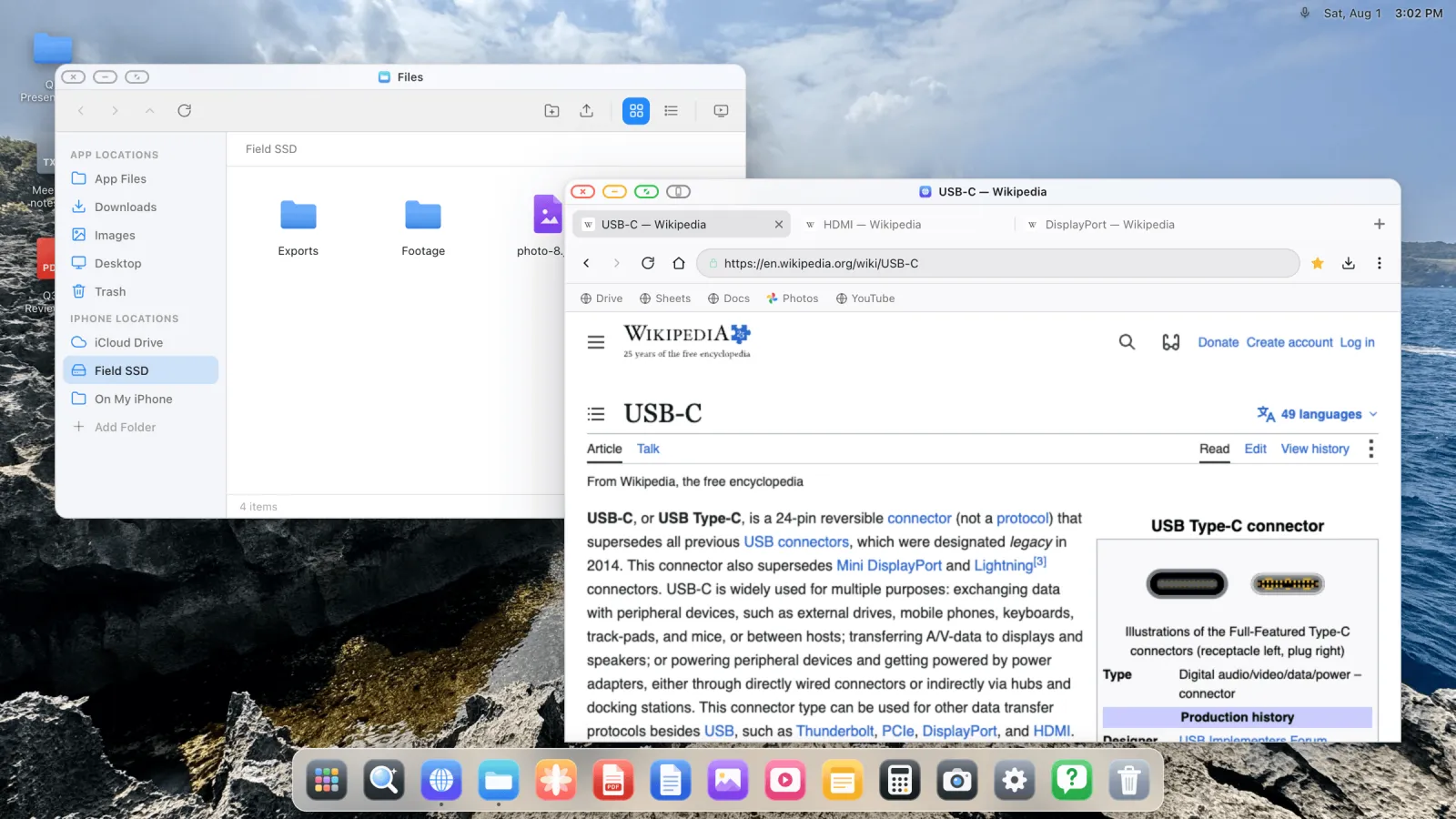 A light-theme desktop with a file manager and a browser window on an external display.