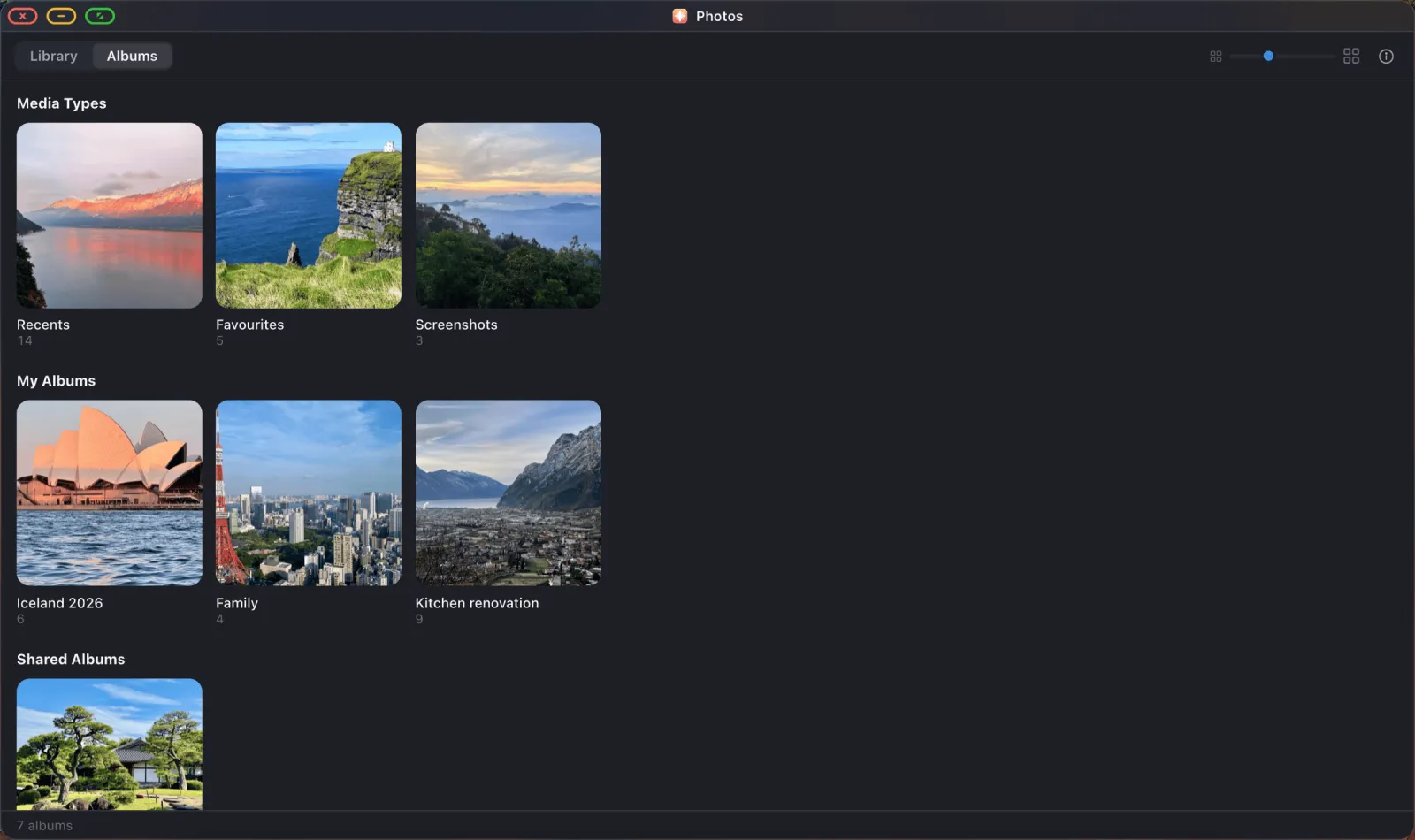 The Albums tab in the XeOS Photos app, showing album covers with names and photo counts.