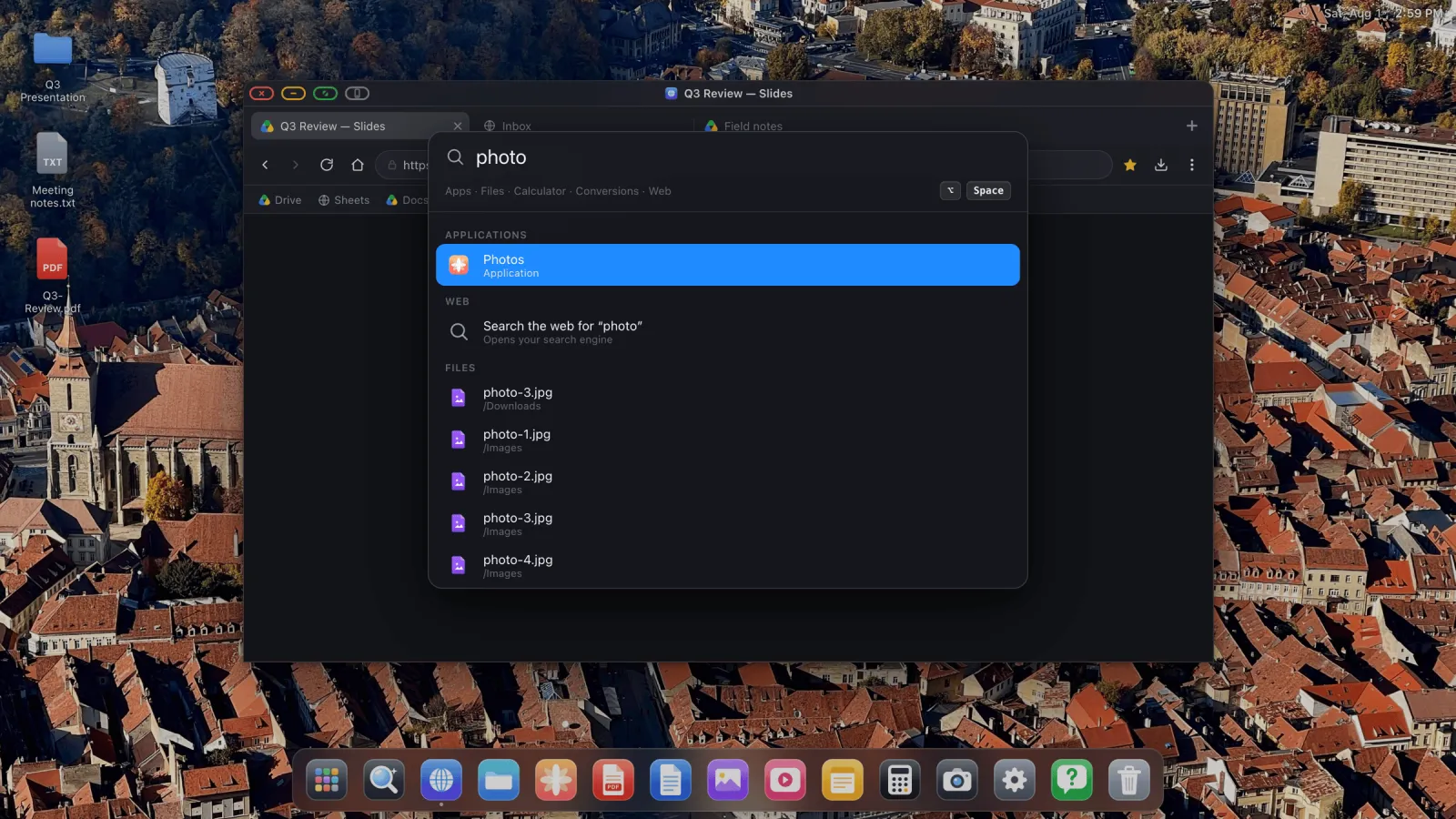 A search overlay on the external display listing an app, a web search and matching files.